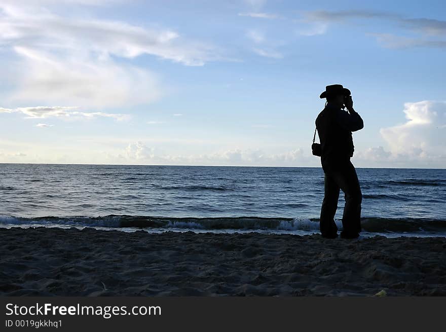 At the seaside, taking photos. At the seaside, taking photos