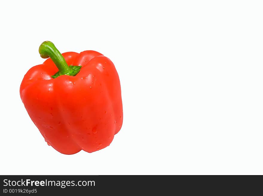 Wet red pepper isolated cleanly against a white background. Wet red pepper isolated cleanly against a white background.