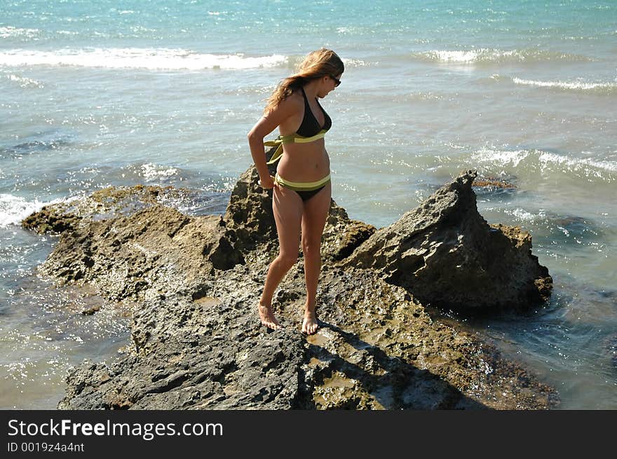 Attractive teen on sicilian rocks. Attractive teen on sicilian rocks