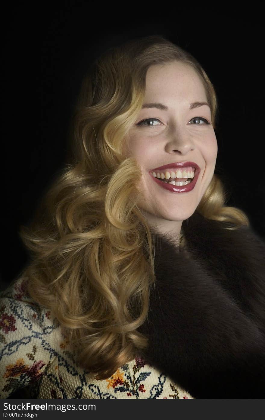 Smiling woman in a fur collared jacket