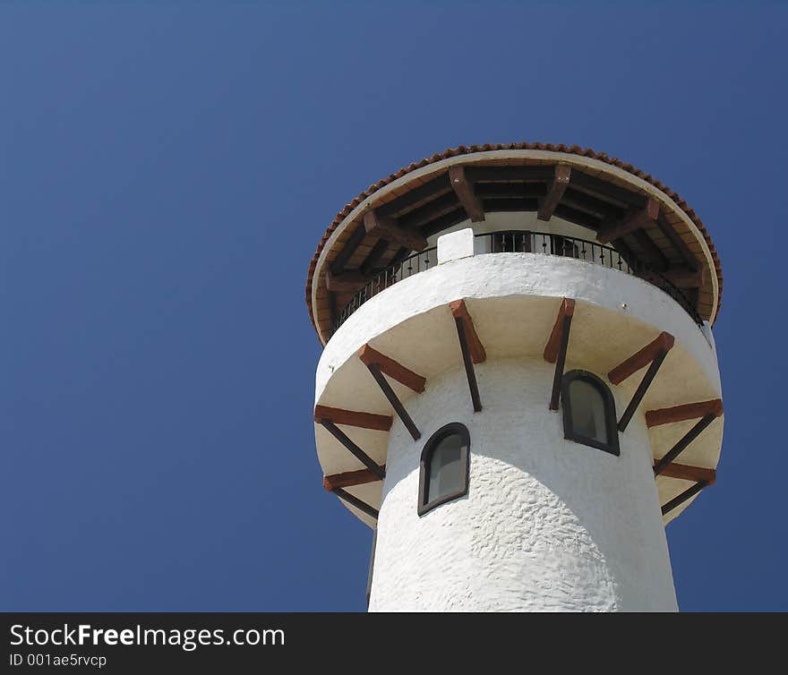 White lighthouse in the marina of Cabo San Lucas / Mexico. White lighthouse in the marina of Cabo San Lucas / Mexico