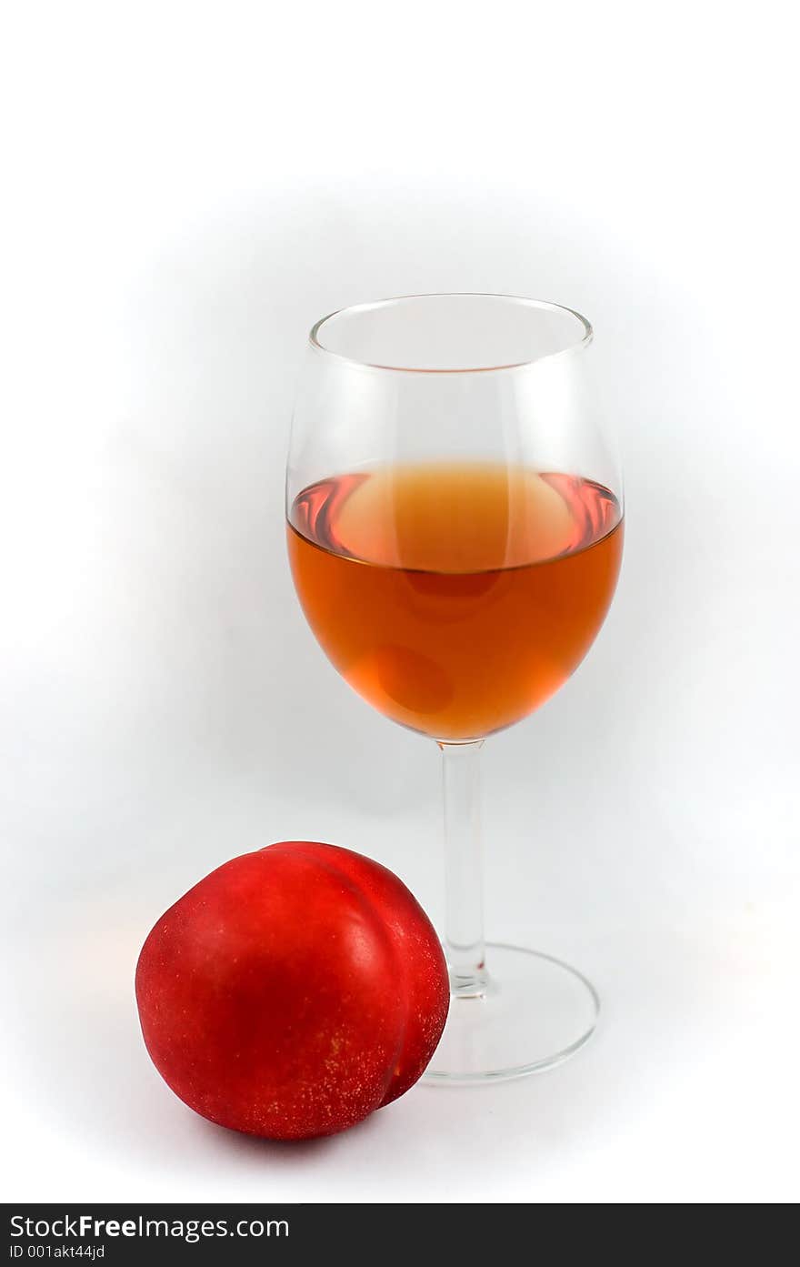 Glass of wine and nectarine. Glass of wine and nectarine