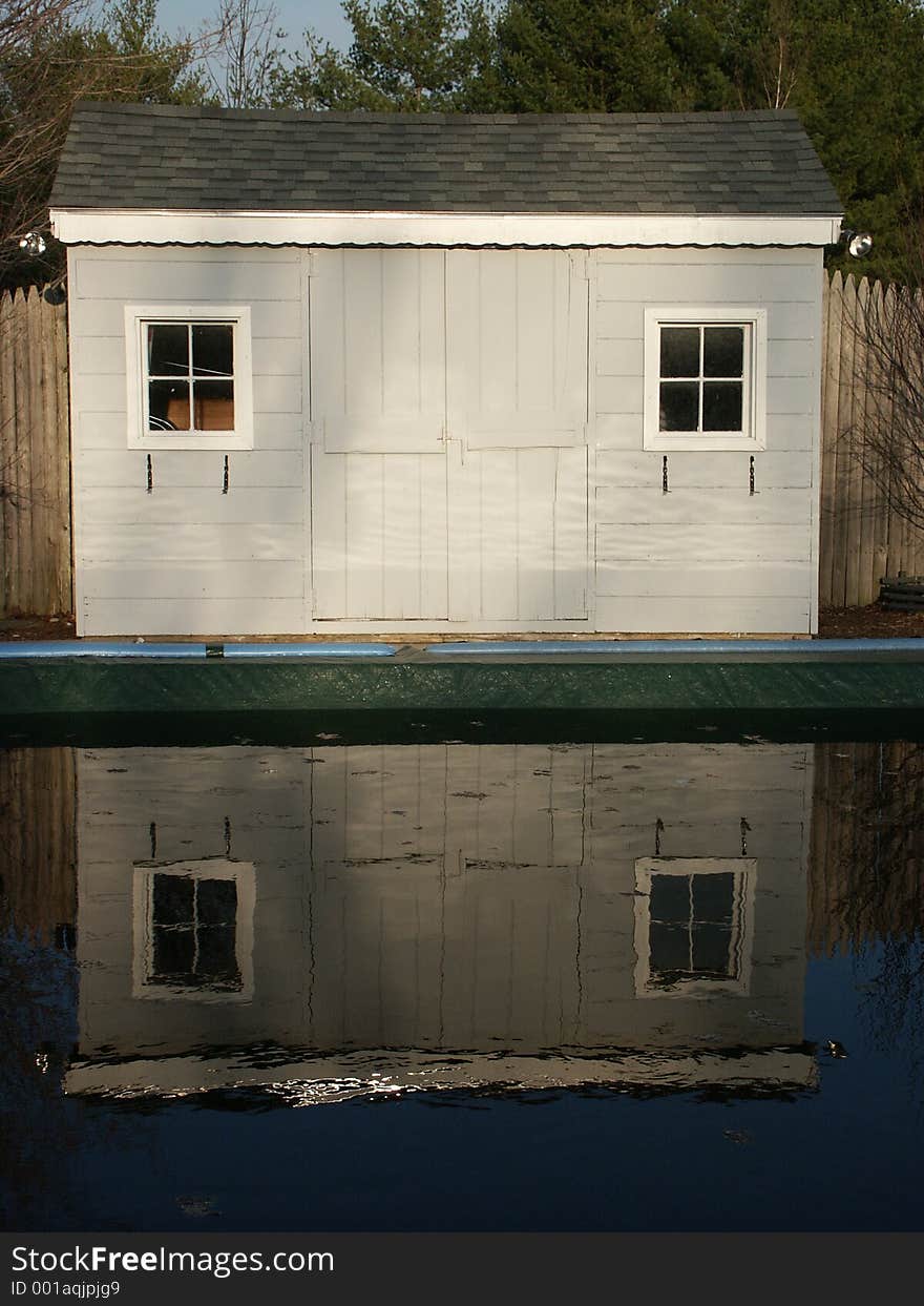 Reflection of a shed in a pool. Reflection of a shed in a pool.