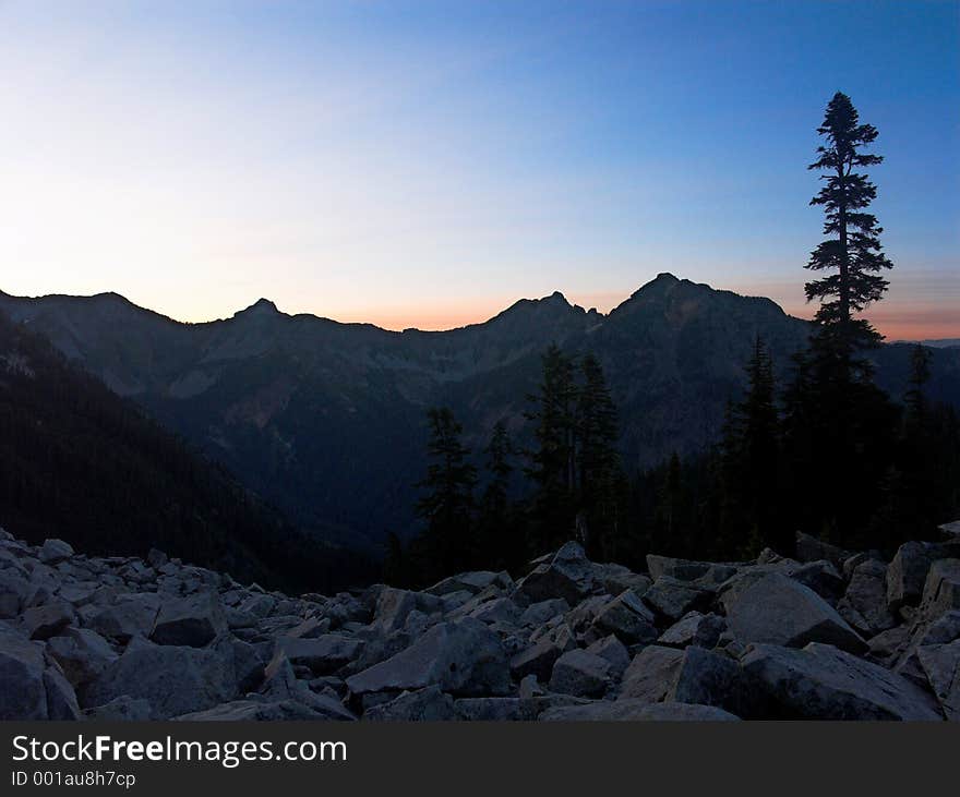 A sunrise view of Alaska Mountain and adjoining ridgeline as seen from the Pacific Crest Trail in Washington State. A sunrise view of Alaska Mountain and adjoining ridgeline as seen from the Pacific Crest Trail in Washington State.