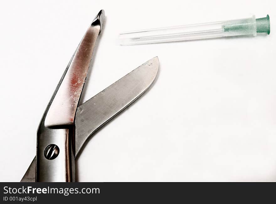 Doctor s scissors and one needle