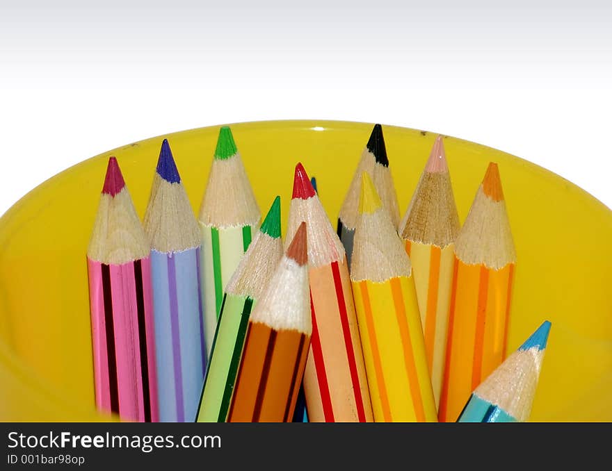 Color pencils in yellow container - closeup