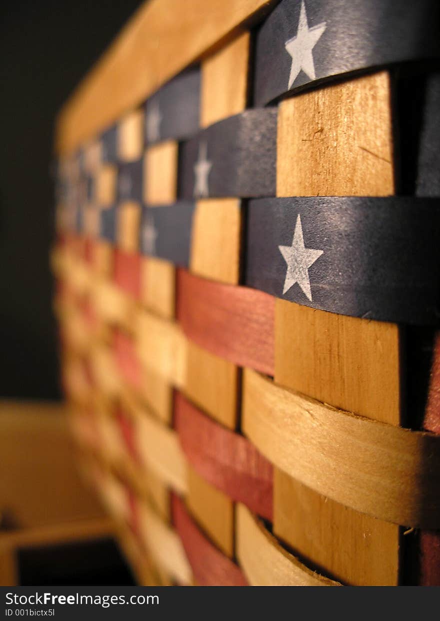 A wooden woven basket painted with America's colors. A wooden woven basket painted with America's colors.