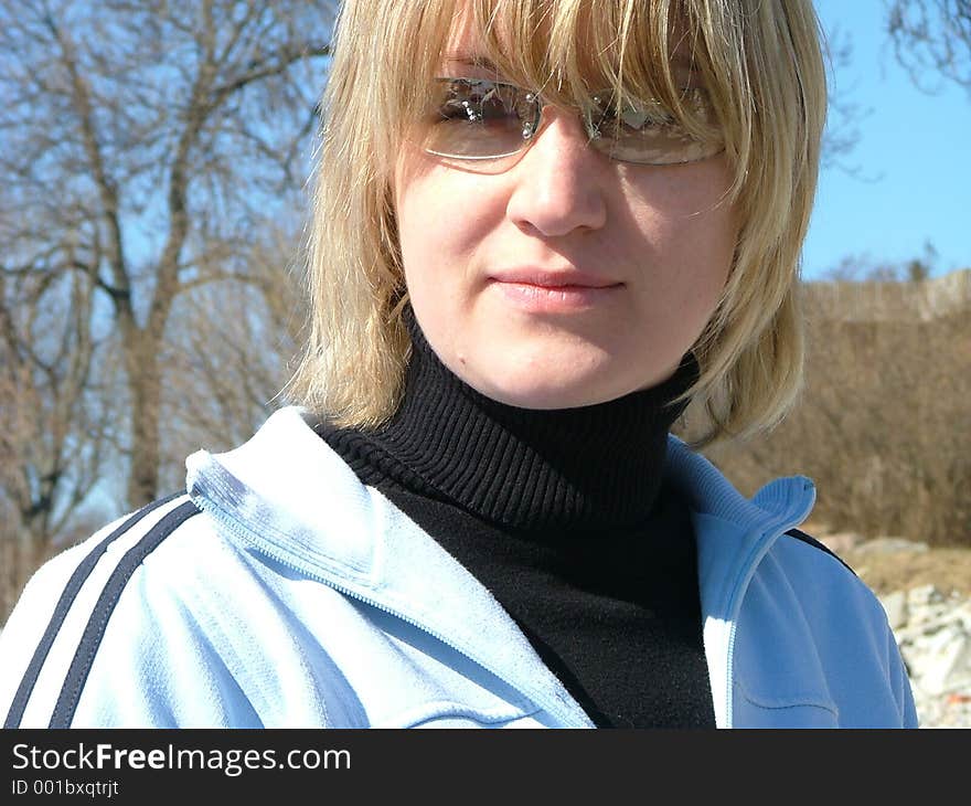 Blond girl looking into the camera