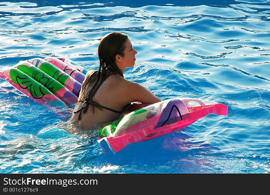 Young woman on pool mattress. Young woman on pool mattress