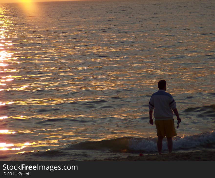 A man looking across Lake Michigan. A man looking across Lake Michigan