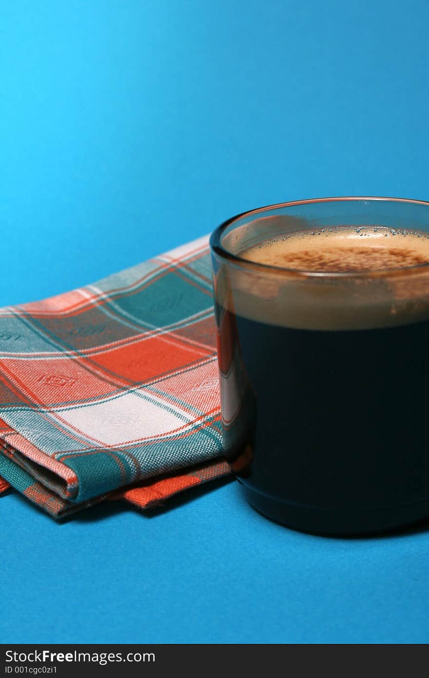 Cup of coffee and towel on blue background. Cup of coffee and towel on blue background