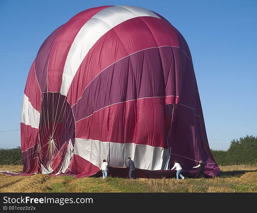 Packing up balloon after landing. Packing up balloon after landing