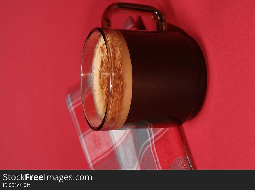 Cup of coffee and towel on red background. Cup of coffee and towel on red background