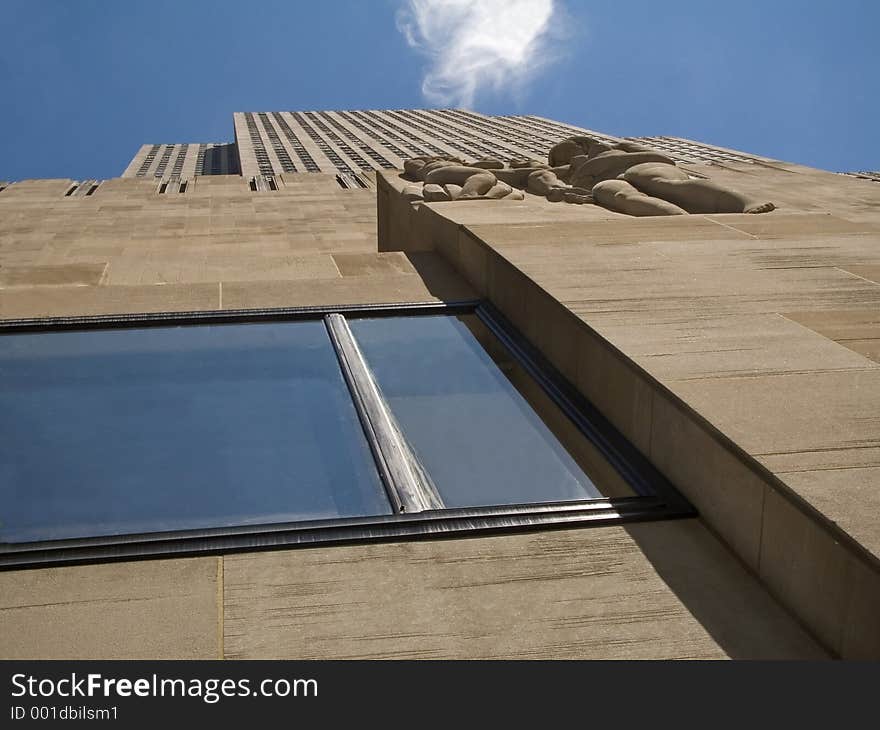 This is a looking up perspective shot of a tall building in Manhattan.