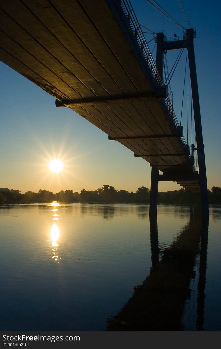 Suspension bridge in sunrise