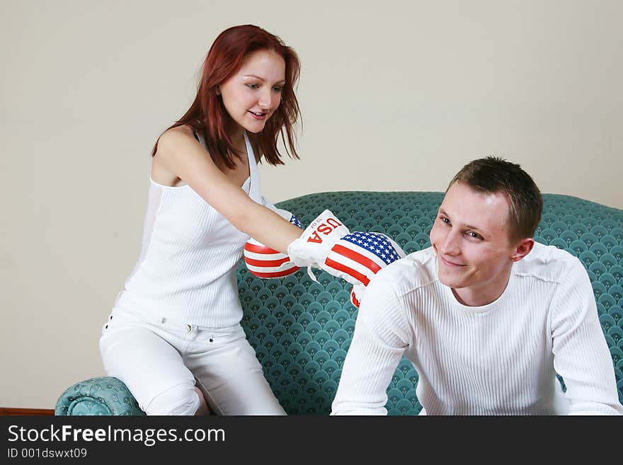 Young girl punching her friend. Young girl punching her friend