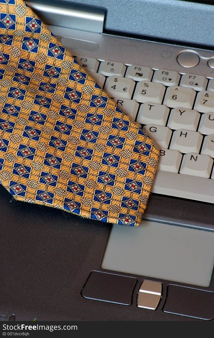 A scarf on a laptop keyboard. A scarf on a laptop keyboard