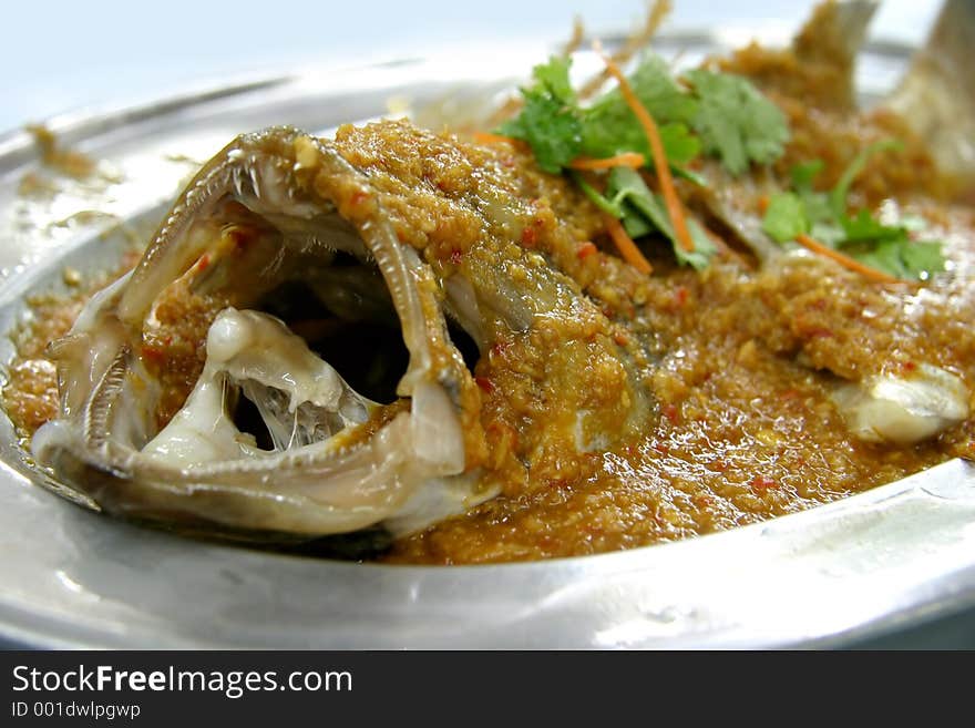 Ginger chilli steamed fish on a silver plate