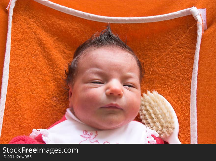 A baby with a punky hairstyle. A baby with a punky hairstyle.