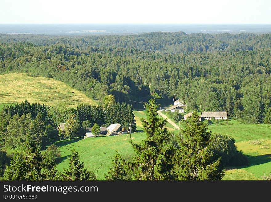 A splendid view over the mild hills of Estonian landscape, much forest some houses and fields. Taken from the highest point of southern Estonia. A splendid view over the mild hills of Estonian landscape, much forest some houses and fields. Taken from the highest point of southern Estonia.