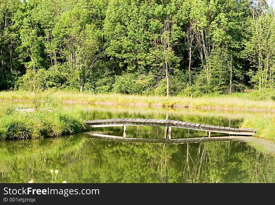 Wooden bridge over pond - horizontal