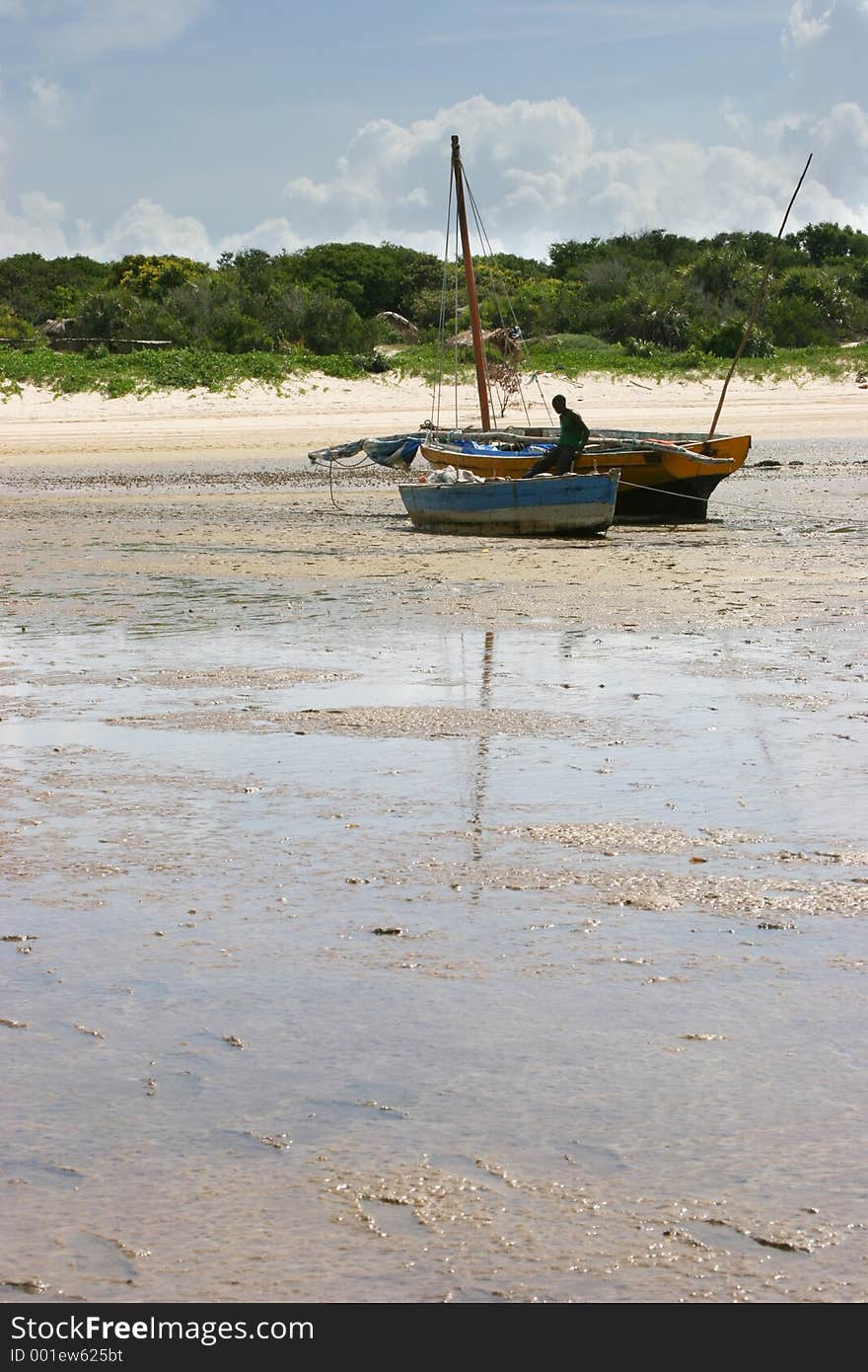 Two stranded fishing boats during low tide