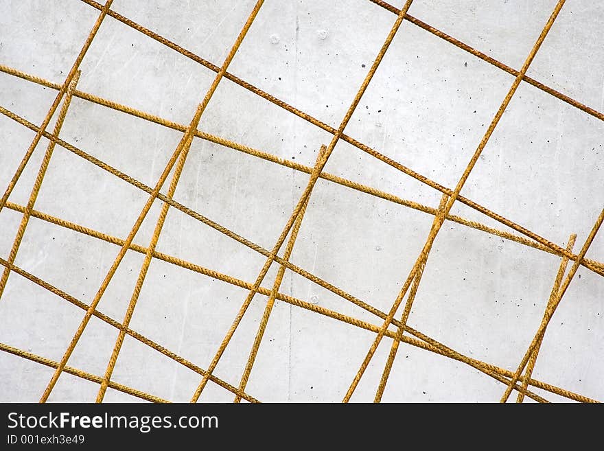 Lattices for reinforced concrete on a contruction site, leaning against a wall. Lattices for reinforced concrete on a contruction site, leaning against a wall