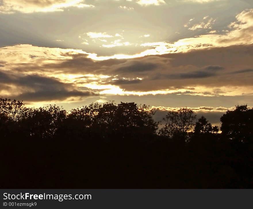 A burst of light from behind clouds