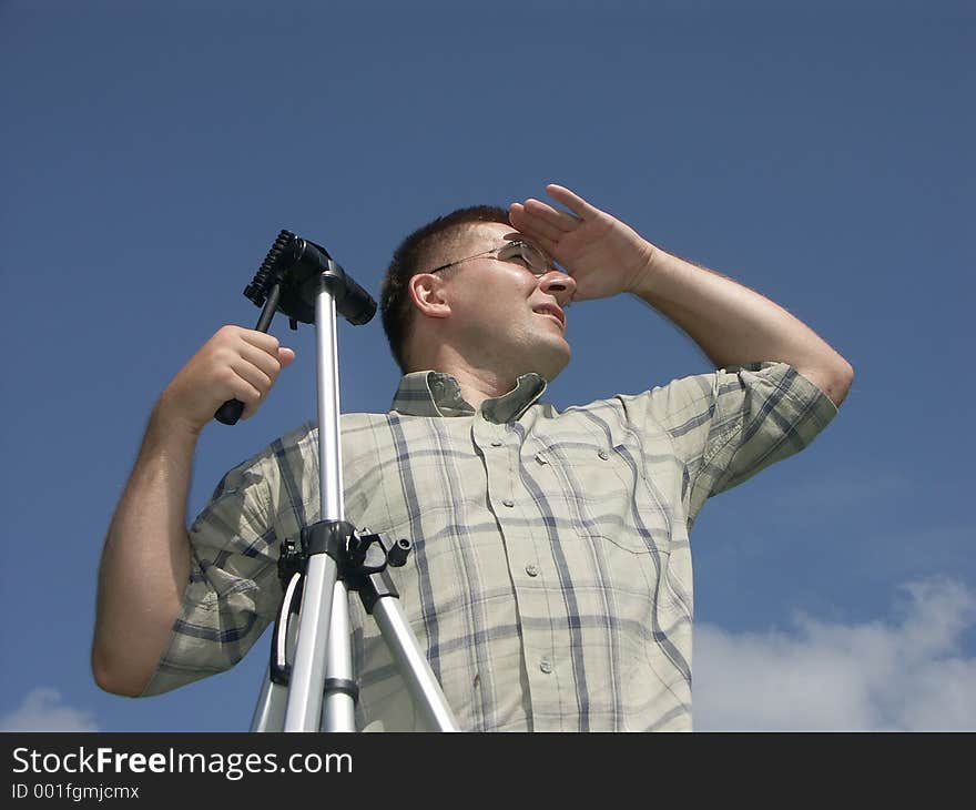 Photographer with a tripod looking ahead 0814_08. Photographer with a tripod looking ahead 0814_08