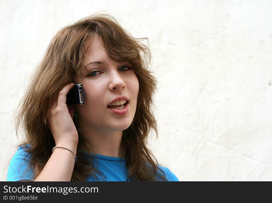 Teenage girl talking on the phone. Teenage girl talking on the phone