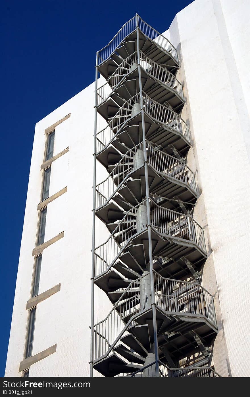 Fire escape stairs on a whit wall