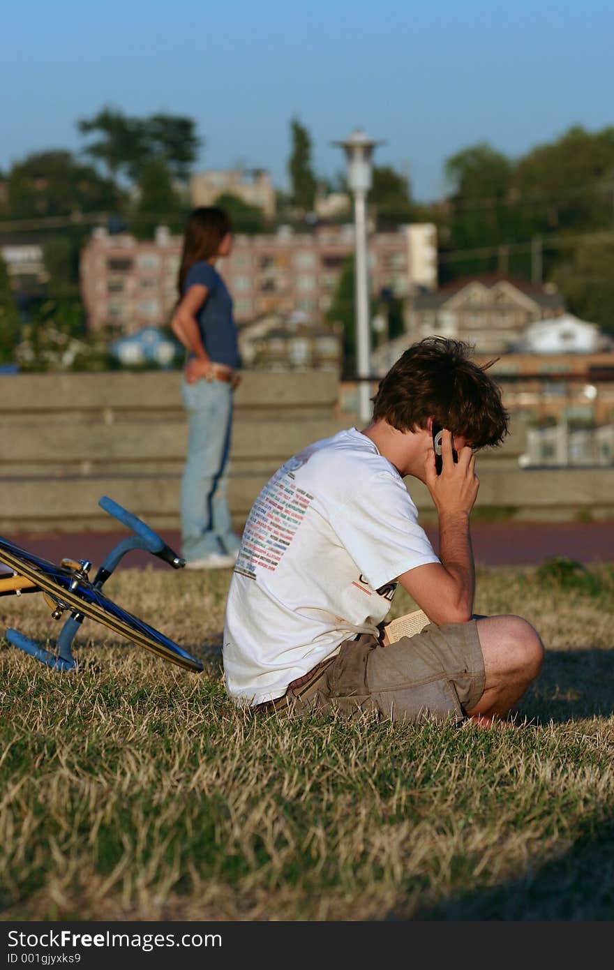 A young man on the phone enjoying the feeling of closeness a cell phone can offer. A young man on the phone enjoying the feeling of closeness a cell phone can offer