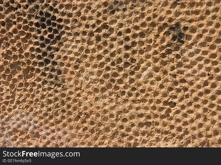 A pattern engraved in rock at close up. Suitable for backgrounds. Rock was found in a historic park dated around 3000 B.C. A pattern engraved in rock at close up. Suitable for backgrounds. Rock was found in a historic park dated around 3000 B.C.