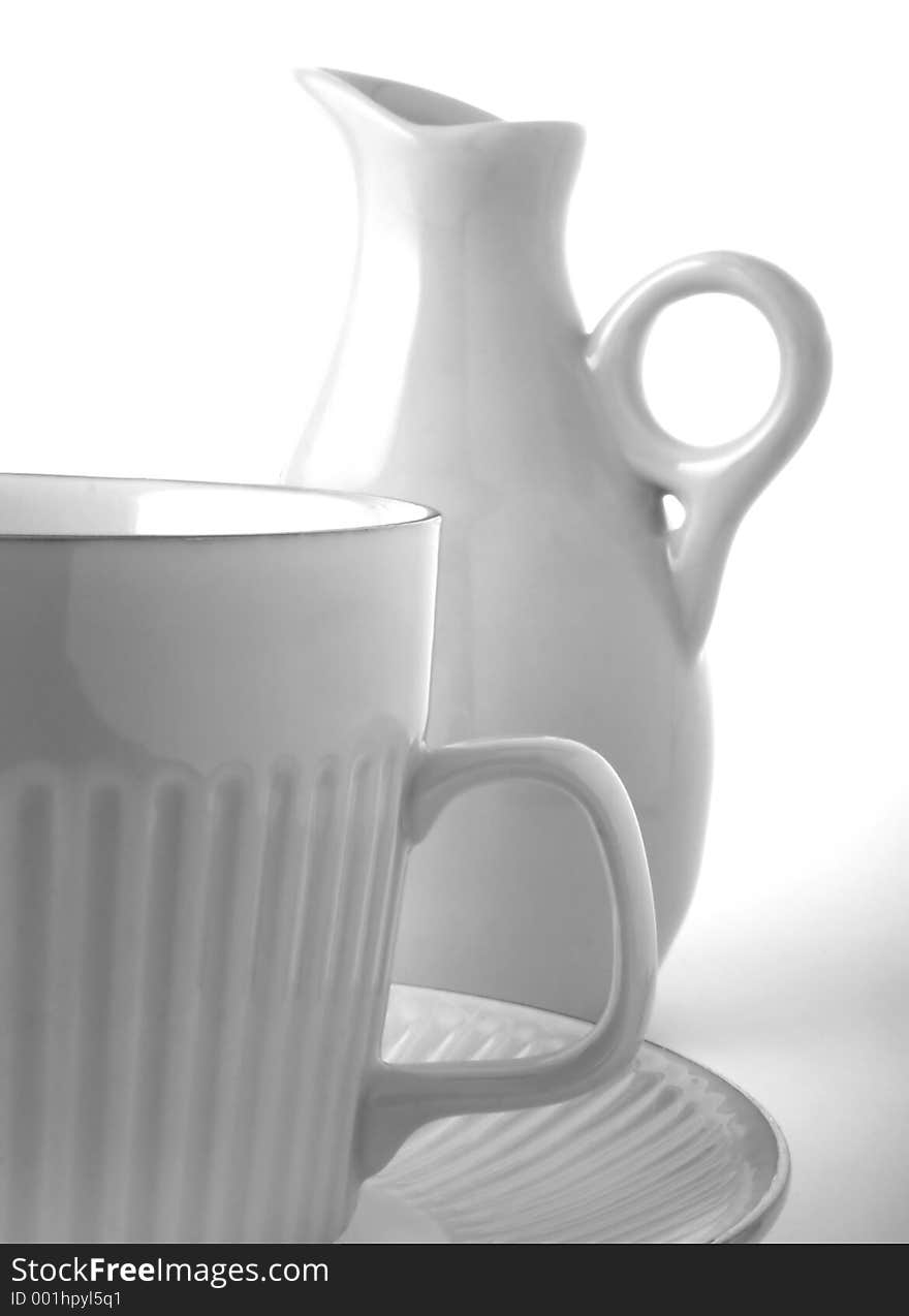 Coffee cup,saucer and creamer in black and white high key. Coffee cup,saucer and creamer in black and white high key.