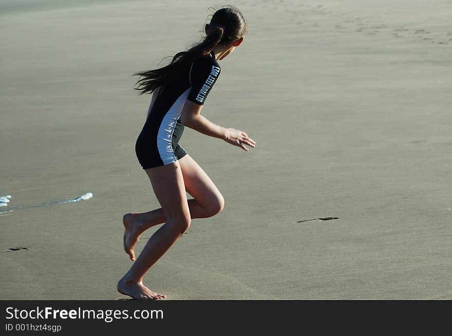 Young girl on beach playing. Young girl on beach playing