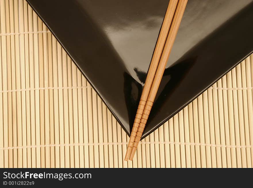 Bamboo mat, dish and chopsticks. Bamboo mat, dish and chopsticks