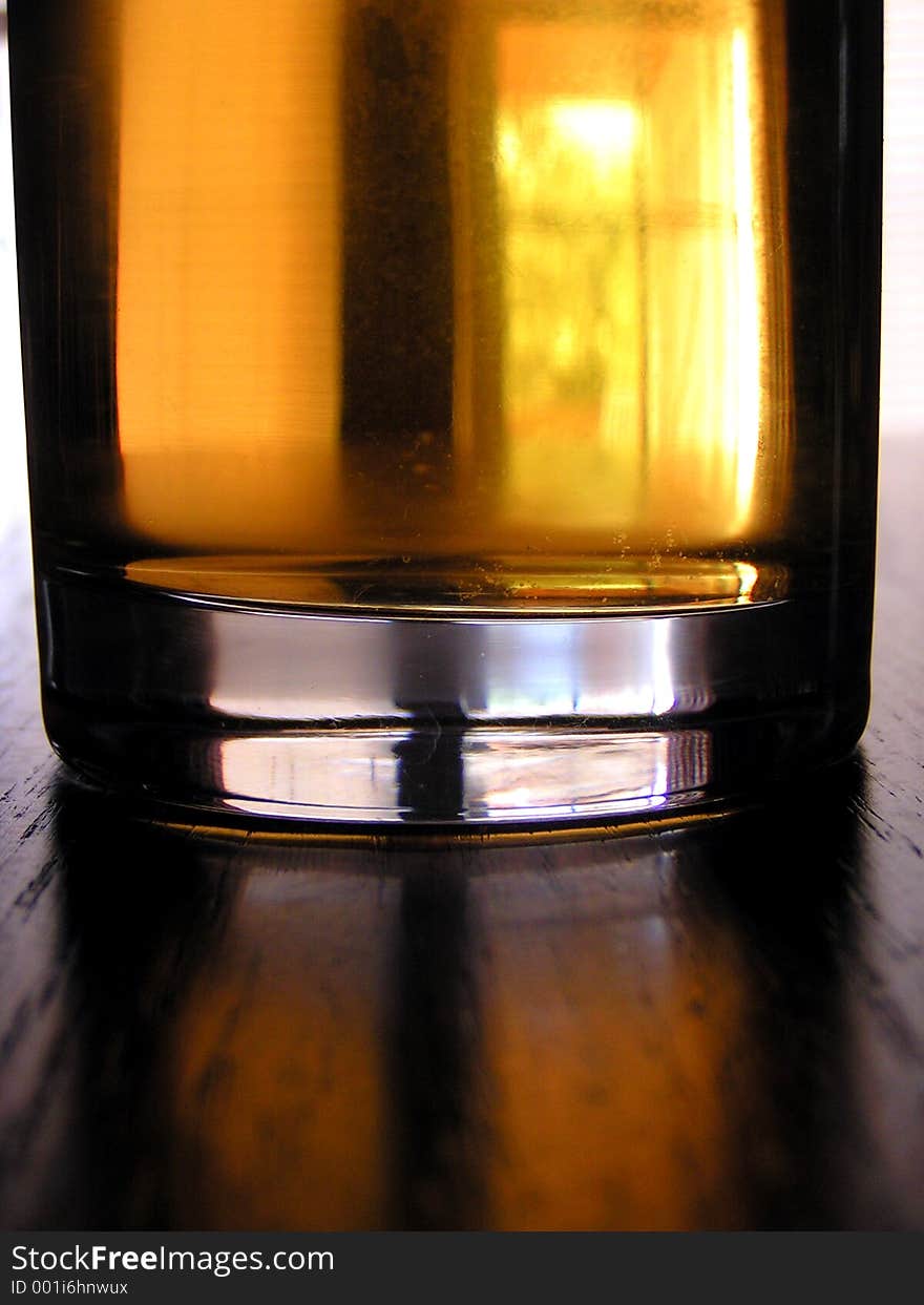 A closeup of a glass of apple juice, although it has the look of brew. A closeup of a glass of apple juice, although it has the look of brew.