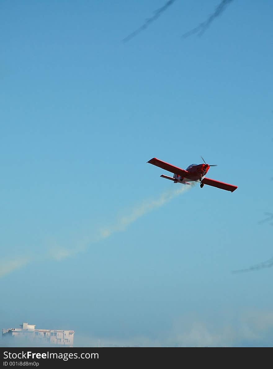 Red plane on blue sky. Red plane on blue sky