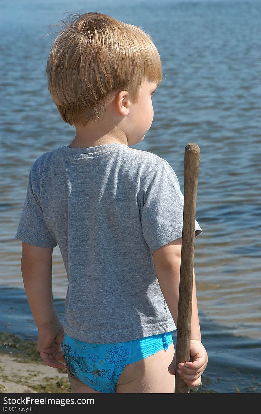 Young boy playing at the beach