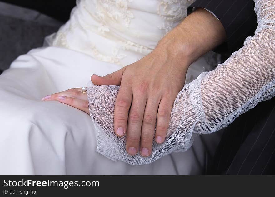 Hands of a new married couple. Hands of a new married couple