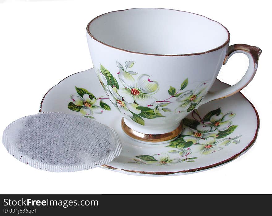 Isolated tea cup with saucer and tea bag