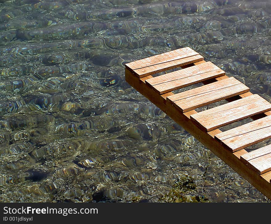 Gangway over a crystal clear water at the Korkula island (Croatia). Gangway over a crystal clear water at the Korkula island (Croatia)