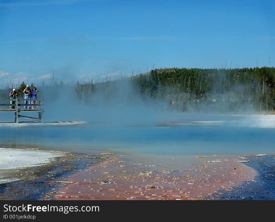 Photographers shooting Jewel Geyser in Yellowstone National Park, Wyoming. Photographers shooting Jewel Geyser in Yellowstone National Park, Wyoming