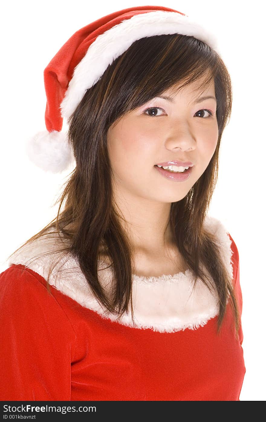 A cute young asian woman in a santa costume. A cute young asian woman in a santa costume