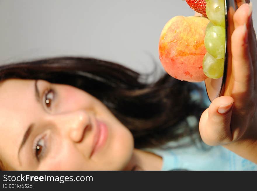 Pretty girl offering fruits. Pretty girl offering fruits