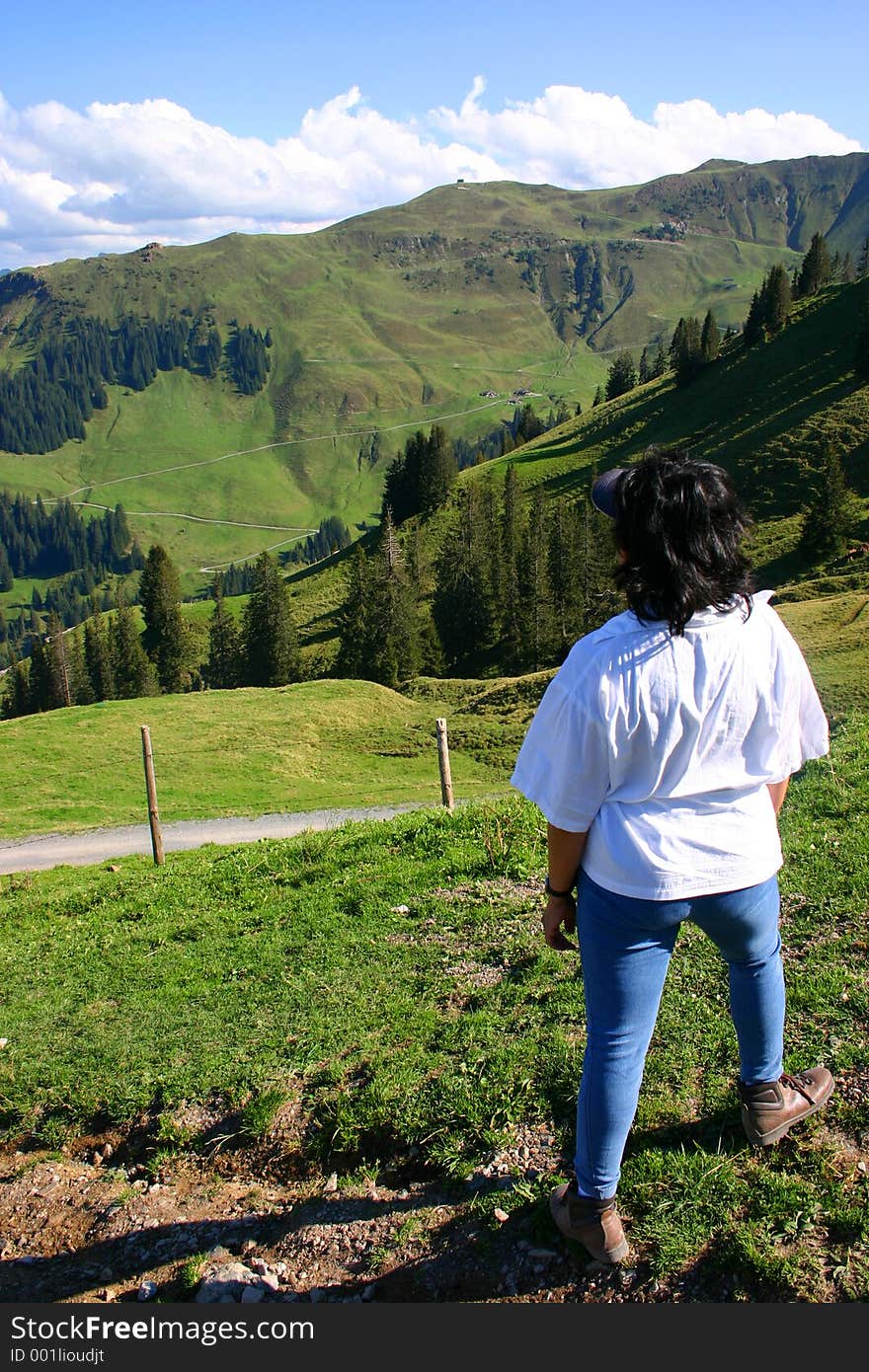 Asian lady walker gazes at the Austrian Tyrol. Asian lady walker gazes at the Austrian Tyrol