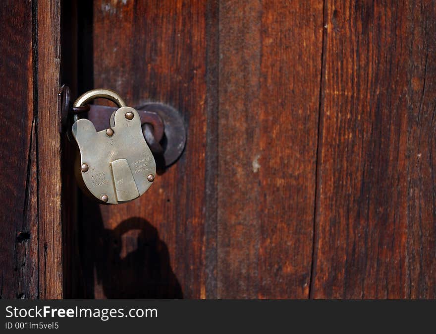 Door with old padlock in horizontal format. Door with old padlock in horizontal format