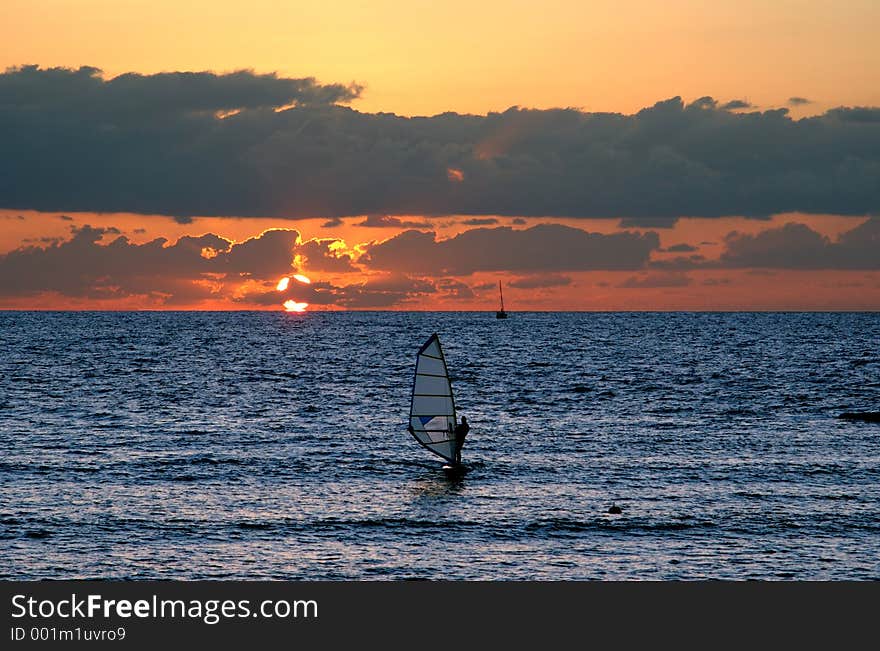 Windsurfer at sunset in the Mediteranien sez. Windsurfer at sunset in the Mediteranien sez