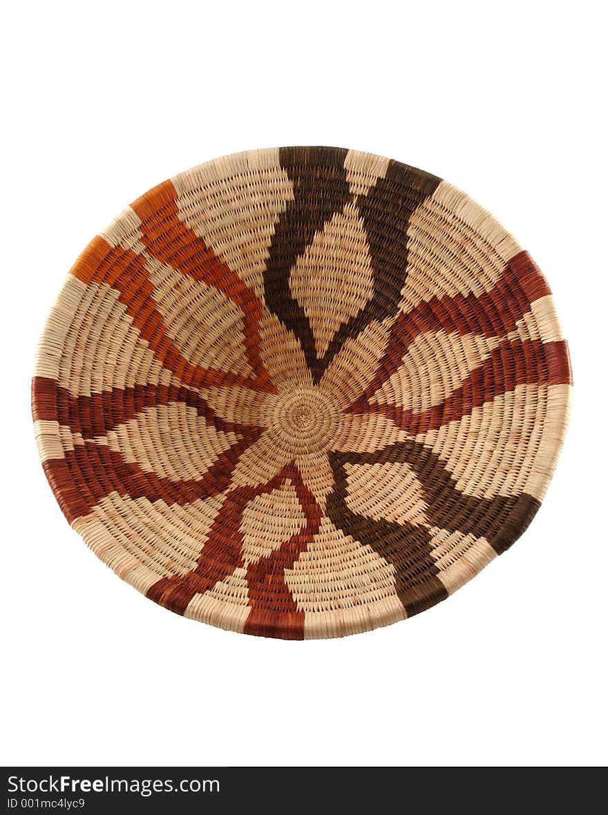 Woven open basket from Botswana. Made from the fiber of the Mokola palm tree. The natural cream-coloured fiber is dyed shades of brown with roots or bark of the Motlhakola and Motsentsila trees.