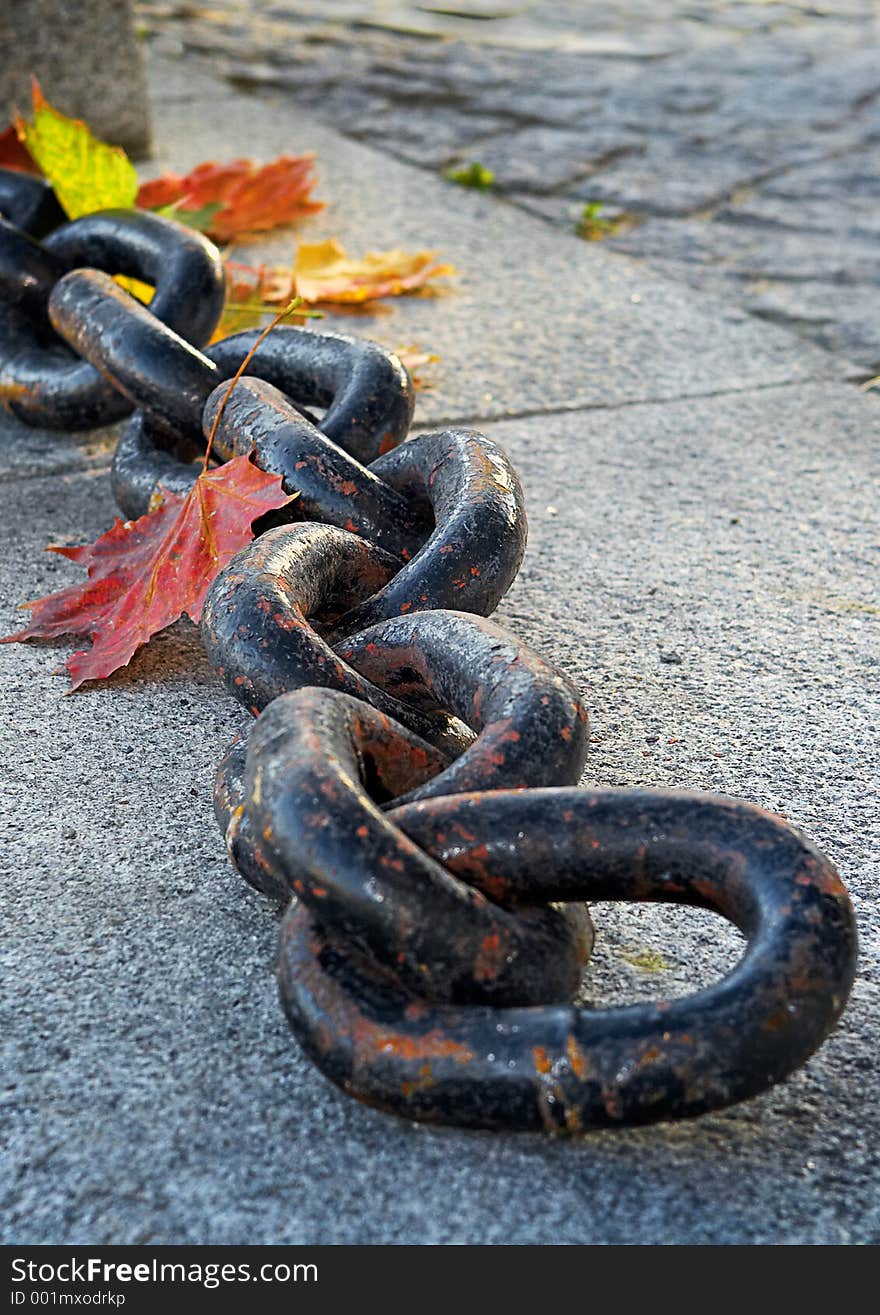 Beauty of fading autumn and rusty chain